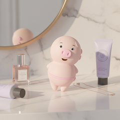 Estimulador Piggie Licks con lengua vibrante de 6 velocidades para clítoris y pezones, diseño rosa coqueto Glow & Vibe.