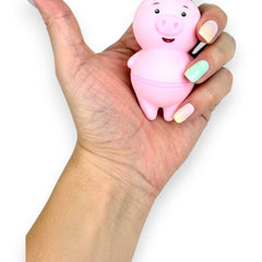 Estimulador Piggie Licks con lengua vibrante de 6 velocidades para clítoris y pezones, diseño rosa coqueto Glow & Vibe.