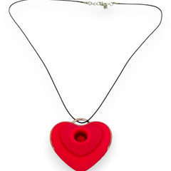 Estimulador Love Shape Necklace con diseño de collar y 10 velocidades de succión y pulsación, joya del placer Glow & Vibe.