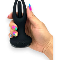 Tappy Plug Glow & Vibe con estimulador móvil de punto G, dilatador anal y control remoto, recargable y de silicón suave.