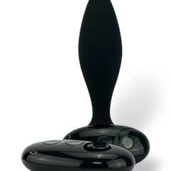 Noir Pulse Glow & Vibe, dilatador anal con control remoto, 10 funciones y carga magnética, hecho de silicón suave y elegante.