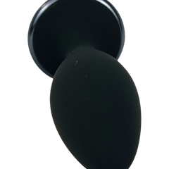 Noir Pulse Glow & Vibe, dilatador anal con control remoto, 10 funciones y carga magnética, hecho de silicón suave y elegante.