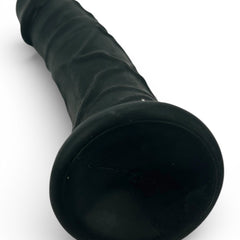 Dark Rider Glow & Vibe, dildo realista de material Magic Flesh con ventosa resistente y textura natural.