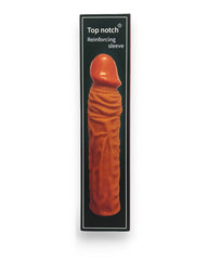 Titan Skin Sleeve Glow & Vibe, funda extensora de pene con textura realista de Magic Flesh y 4 cm de extensión.