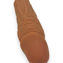 Titan Skin Sleeve Glow & Vibe, funda extensora de pene con textura realista de Magic Flesh y 4 cm de extensión.