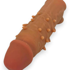 Power Core Sleeve Glow & Vibe, funda extensora de Magic Flesh con soporte para testículos y textura realista.