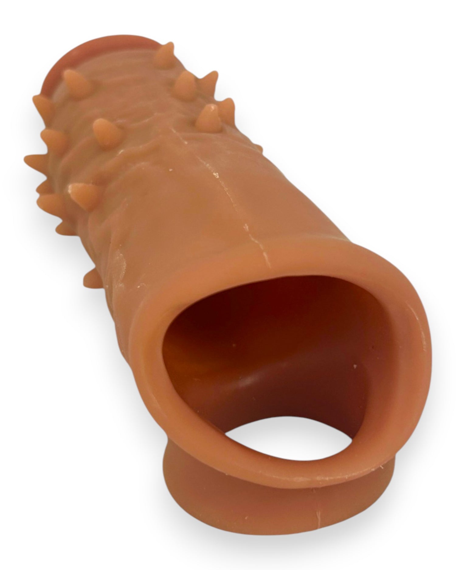 Power Core Sleeve Glow & Vibe, funda extensora de Magic Flesh con soporte para testículos y textura realista.