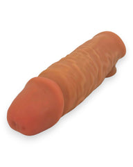 Mega Grip Sleeve Glow & Vibe, funda extensora realista de Magic Flesh con soporte para testículos y textura estimulante.