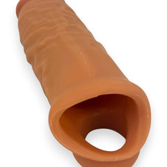 Mega Grip Sleeve Glow & Vibe, funda extensora realista de Magic Flesh con soporte para testículos y textura estimulante.