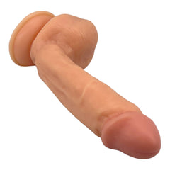 Dildo ultra realista Real King Magic Flesh con ventosa y testículos, textura suave y detallada, marca Glow & Vibe.