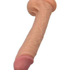 Dildo ultra realista Real King Magic Flesh con ventosa y testículos, textura suave y detallada, marca Glow & Vibe.