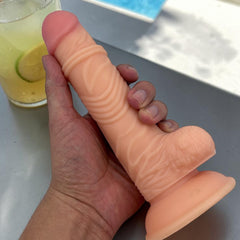 Dildo realista Marcus con testículos y ventosa, color piel, material suave y firme de Glow & Vibe.