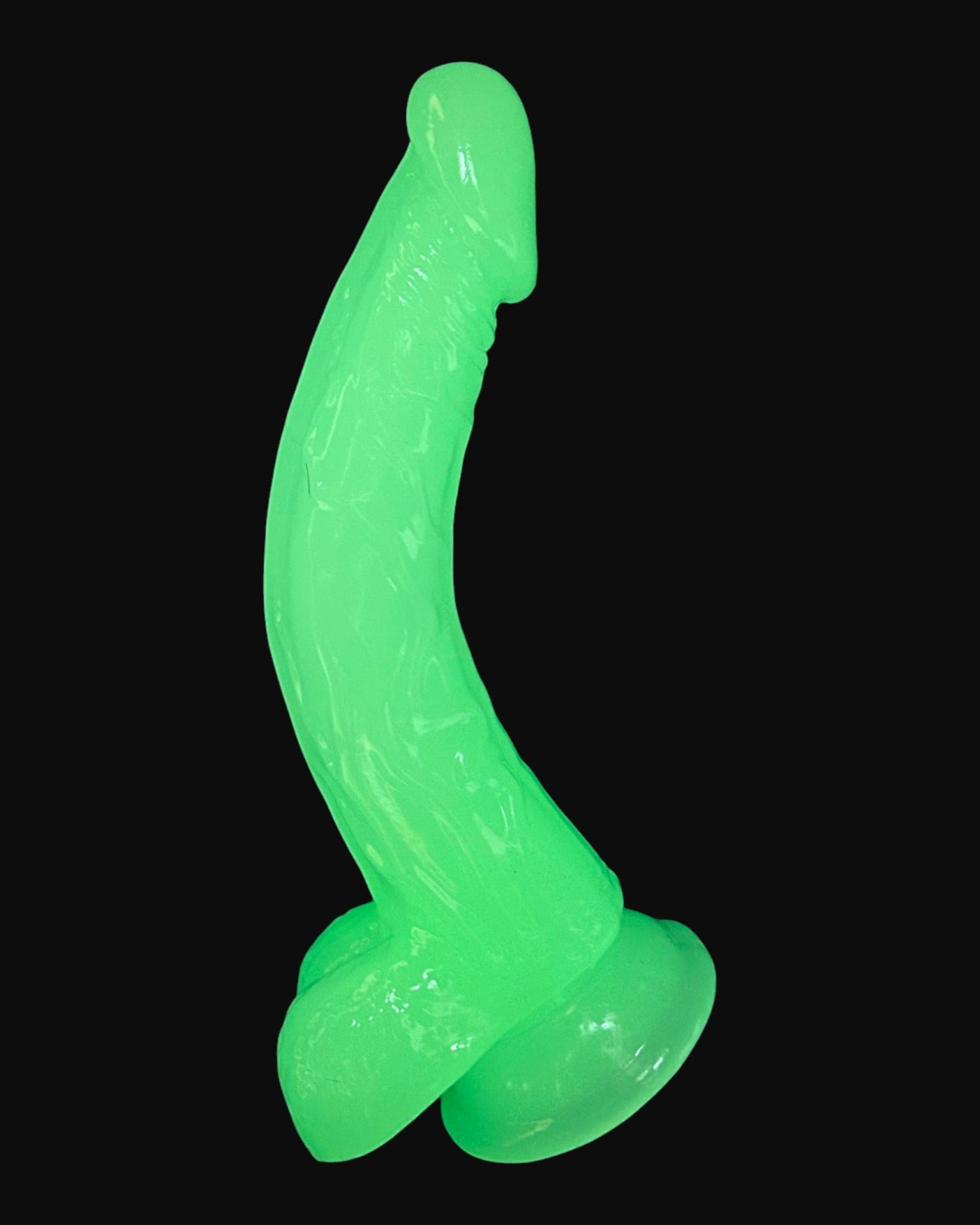 Dildo fluorescente Glow Rider con ventosa y forma curva, brilla en la oscuridad, marca Glow & Vibe.