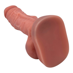 Max Dino Glow & Vibe dildo extra grande de Magic Flesh flexible con textura realista y testículos.
