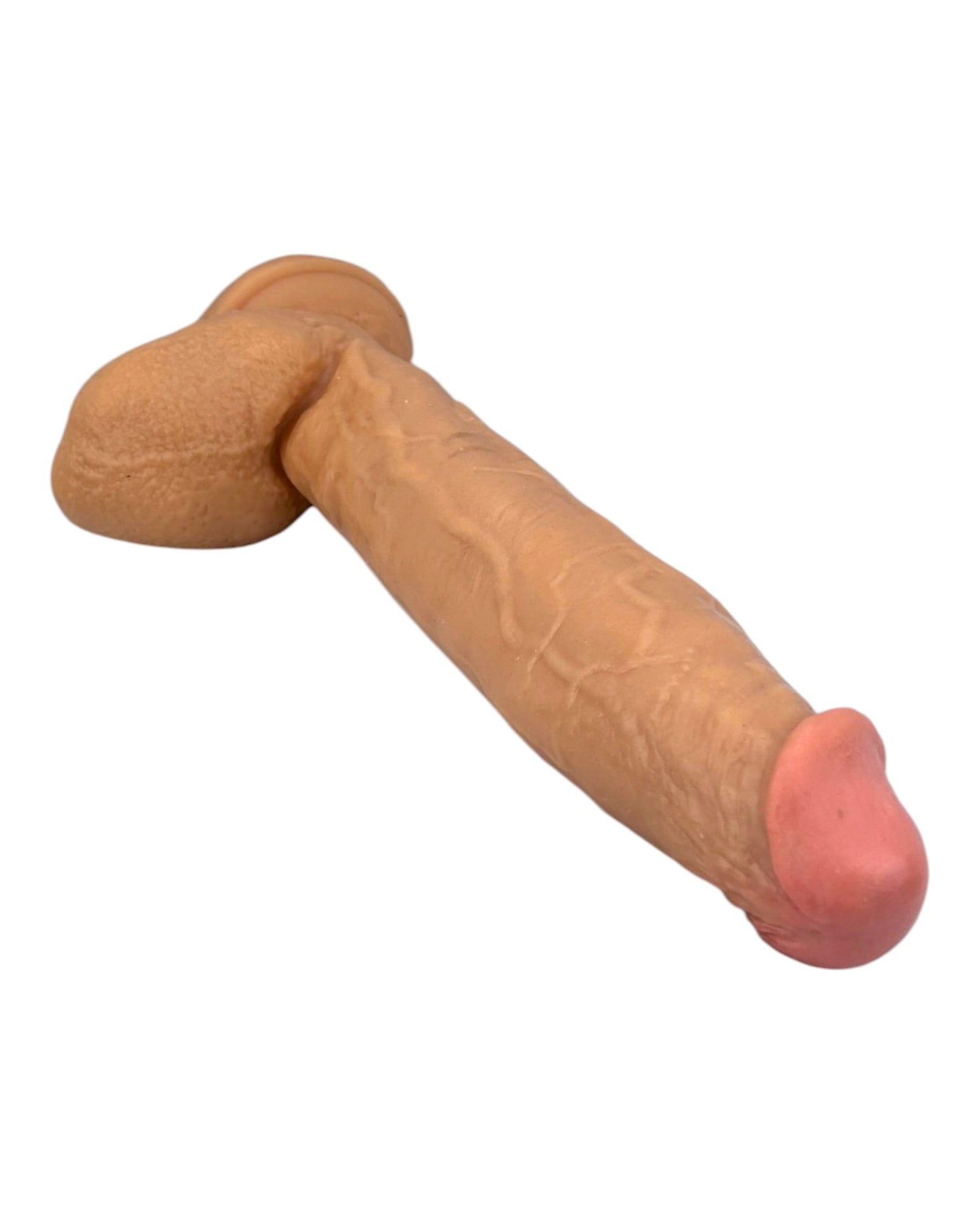Dildo extra grande King Size Magic Flesh con testículos y ventosa, textura ultra realista, marca Glow & Vibe.