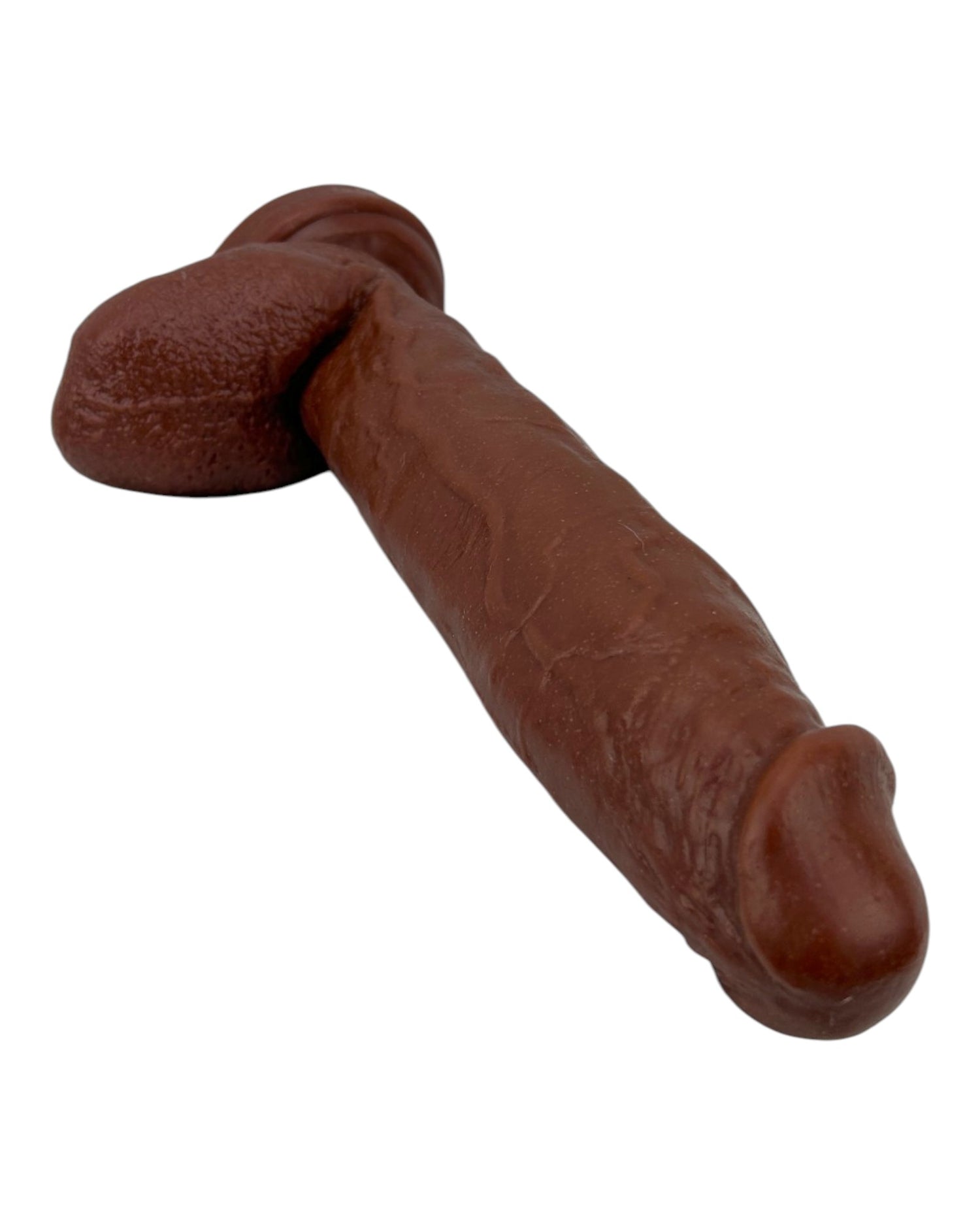 Dildo extra grande King Size Magic Flesh con testículos y ventosa, textura ultra realista, marca Glow & Vibe.