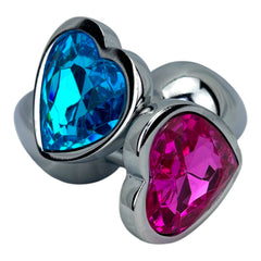 Butt plug metálico Gema Heart con brillante gema en forma de corazón, diseño elegante y coqueto de Glow & Vibe.