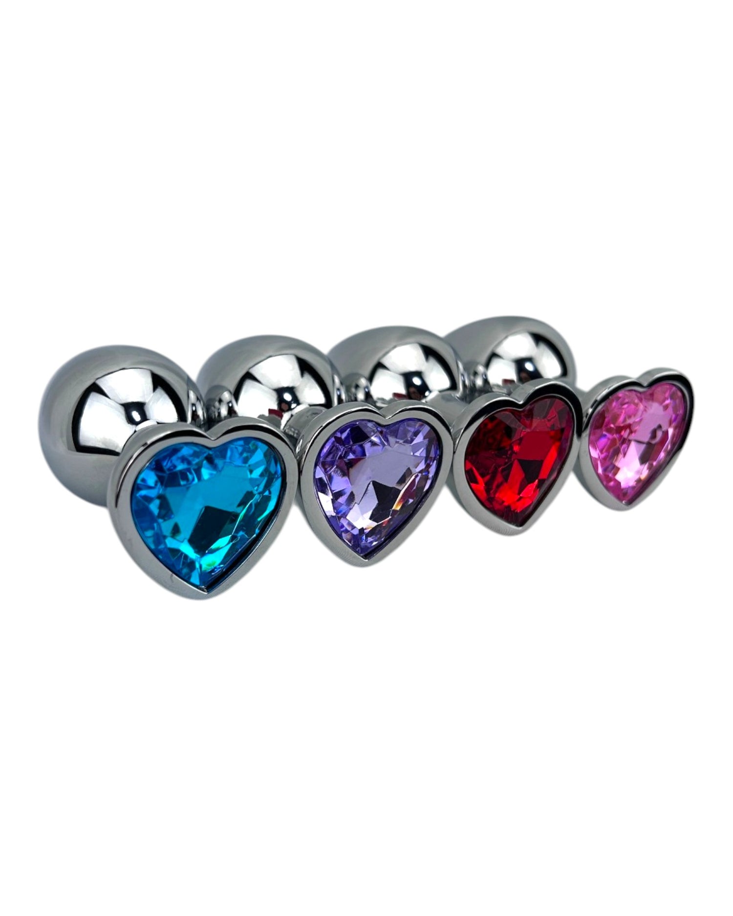 Butt plug metálico Gema Heart con brillante gema en forma de corazón, diseño elegante y coqueto de Glow & Vibe.
