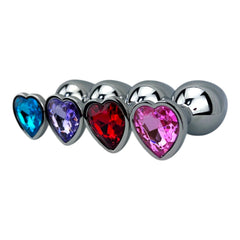 Butt plug metálico Gema Heart con brillante gema en forma de corazón, diseño elegante y coqueto de Glow & Vibe.