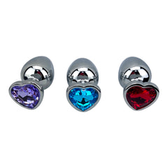 Butt plug metálico Gema Heart con brillante gema en forma de corazón, diseño elegante y coqueto de Glow & Vibe.