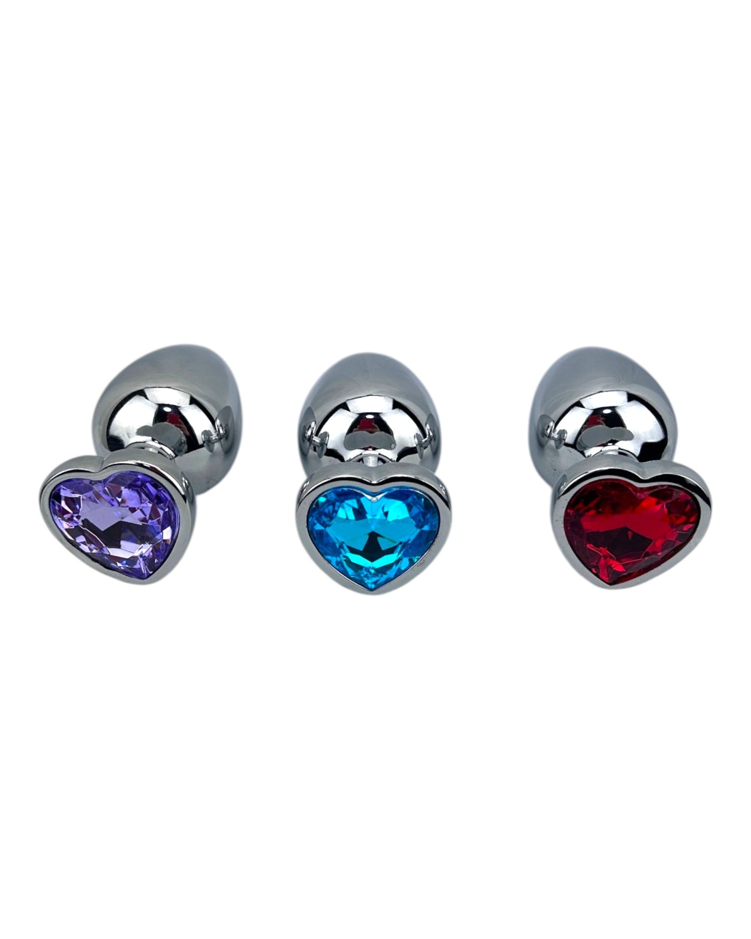 Butt plug metálico Gema Heart con brillante gema en forma de corazón, diseño elegante y coqueto de Glow & Vibe.