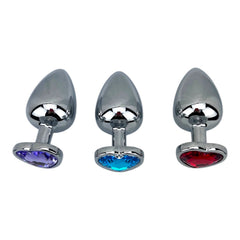 Butt plug metálico Gema Heart con brillante gema en forma de corazón, diseño elegante y coqueto de Glow & Vibe.