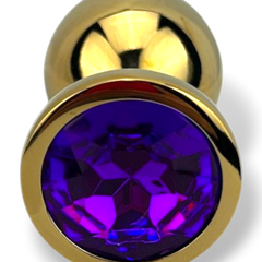 Plug anal metálico Gema Golden en acabado dorado, diseño elegante y lujoso de Glow & Vibe.