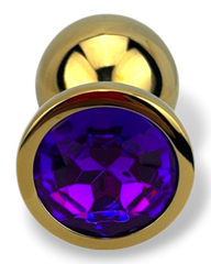 Plug anal metálico Gema Golden en acabado dorado, diseño elegante y lujoso de Glow & Vibe.