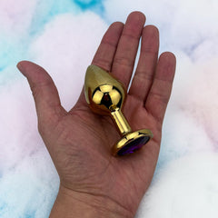 Plug anal metálico Gema Golden en acabado dorado, diseño elegante y lujoso de Glow & Vibe.