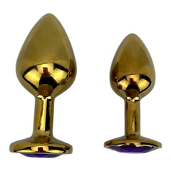 Plug anal metálico Gema Golden en acabado dorado, diseño elegante y lujoso de Glow & Vibe.