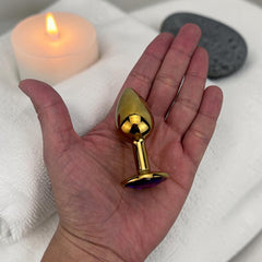 Plug anal metálico Gema Golden en acabado dorado, diseño elegante y lujoso de Glow & Vibe.
