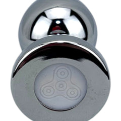 Plug metálico Gema Glow con luz y gema brillante, diseño luminoso y glamuroso de Glow & Vibe.