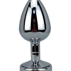 Plug metálico Gema Glow con luz y gema brillante, diseño luminoso y glamuroso de Glow & Vibe.