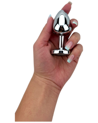 Plug metálico Gema Glow con luz y gema brillante, diseño luminoso y glamuroso de Glow & Vibe.