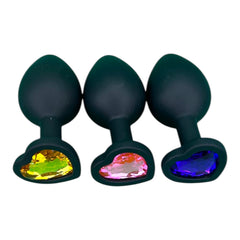Plug anal Gema Dark de silicón negro con gema redonda brillante, diseño elegante y misterioso de Glow & Vibe.