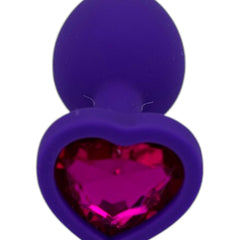 Plug anal Gema Bright de silicón suave con gema redonda, disponible en negro y rosa neón, diseño brillante de Glow & Vibe.