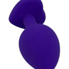 Plug anal Gema Bright de silicón suave con gema redonda, disponible en negro y rosa neón, diseño brillante de Glow & Vibe.