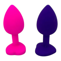 Plug anal Gema Bright de silicón suave con gema redonda, disponible en negro y rosa neón, diseño brillante de Glow & Vibe.