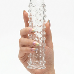 Funda Clear Extender de gel transparente con textura y vibración, silicón suave y diseño realista Glow & Vibe.