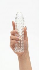 Funda Clear Extender de gel transparente con textura y vibración, silicón suave y diseño realista Glow & Vibe.