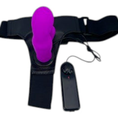 Arnés negro ajustable con dildo de silicona morado texturizado y control remoto, de Glow&Vibe.