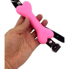 Glow&Vibe Bone Gag rosa de plástico suave con cinturón de cuero sintético, 4.5 cm de bola.