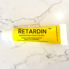 Tubo de crema retardante masculina Retardin de Glow&Vibe de 15g en envase amarillo para mayor control sexual.