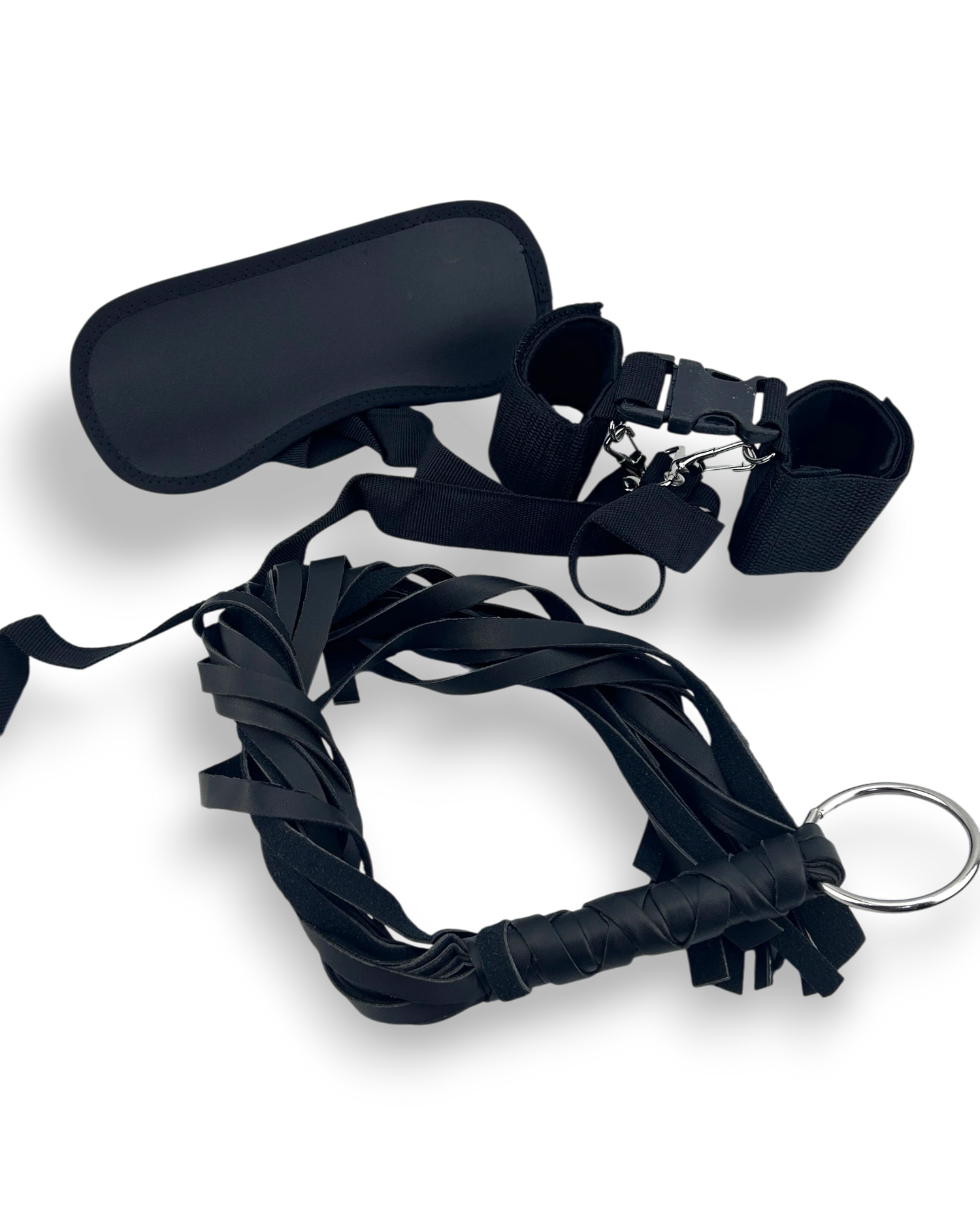 Kit de fantasía oscuro de Glow&Vibe con látigo de vinilo negro, esposas de velcro y antifaz, ideal para juegos BDSM.