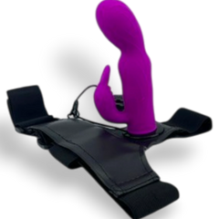 Arnés negro ajustable de Glow&Vibe con dildo de silicona morado texturizado y estimulador de clítoris integrado.