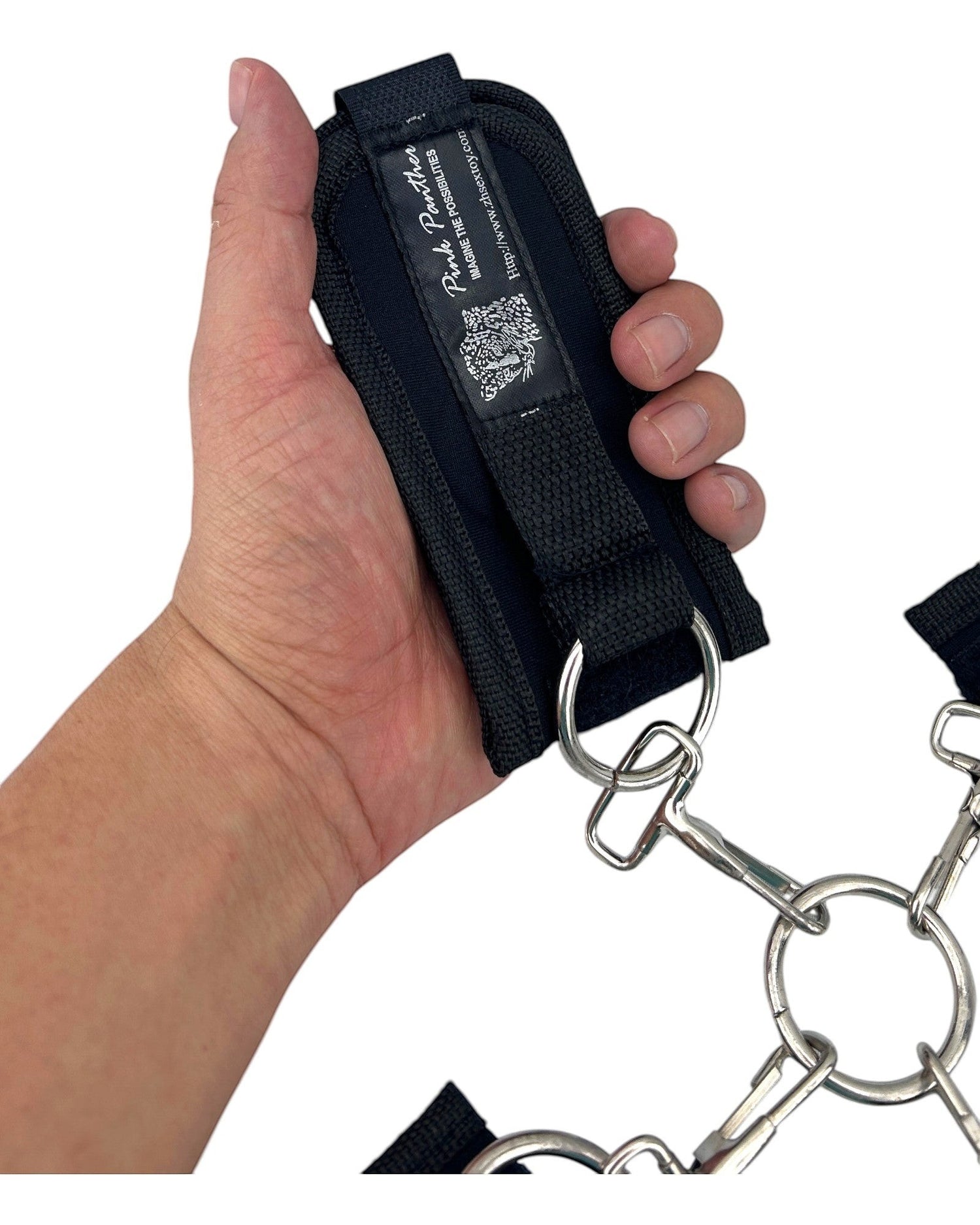 Glow&Vibe Bondage Lure negro, esposas de velcro para manos y pies con anillas metálicas y hebilla central.
