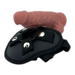 Arnés negro ajustable de Glow&Vibe con dildo articulado de TPE texturizado color melocotón.