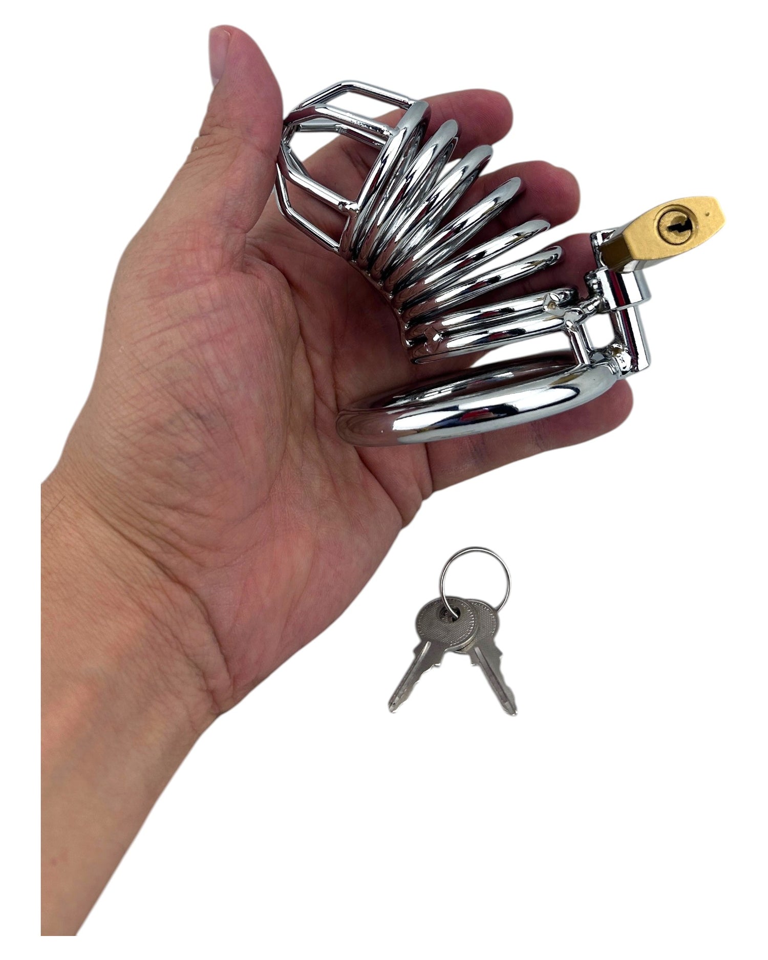 Jaula de pene de metal pulido con aro para testículos y candado con llave de Glow&Vibe. Diseño abierto y seguro.